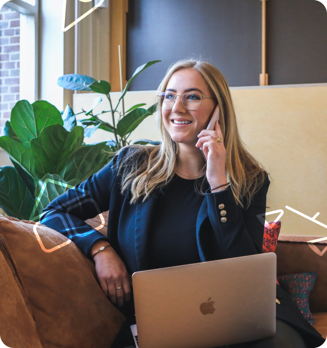 Professional woman happily talking on phone